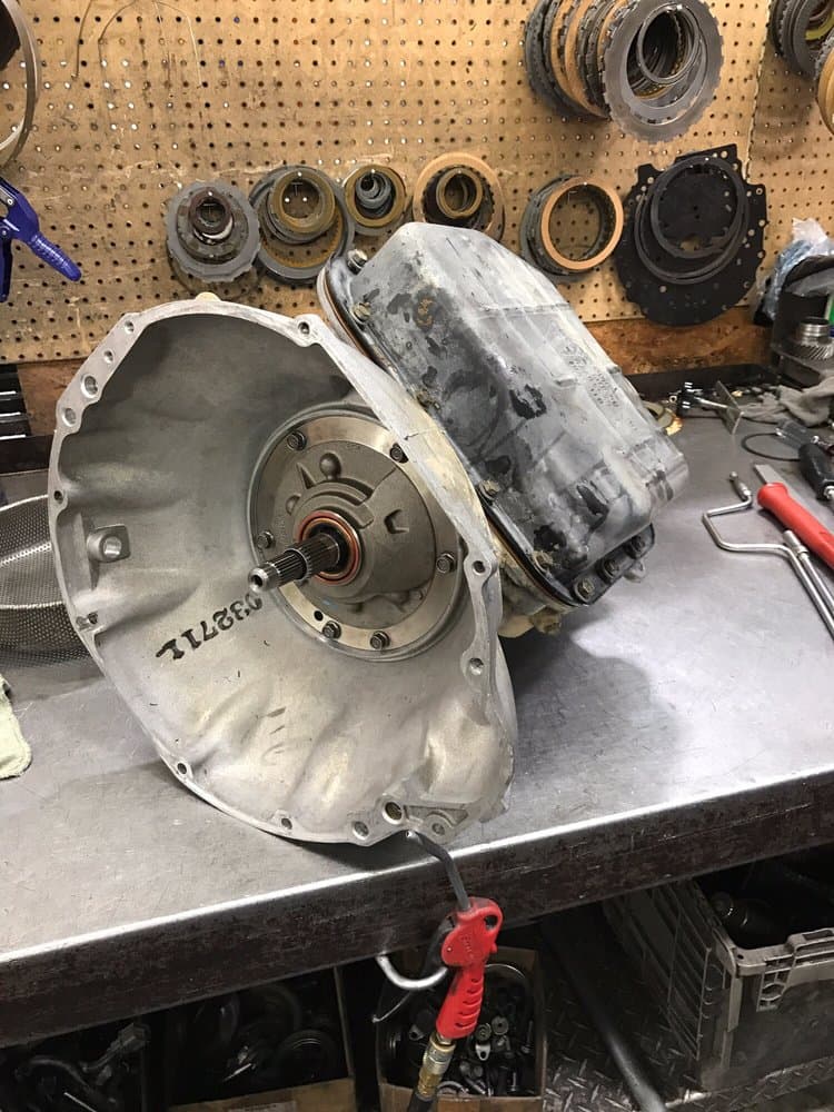 An automatic transmission opened up on the workbench.