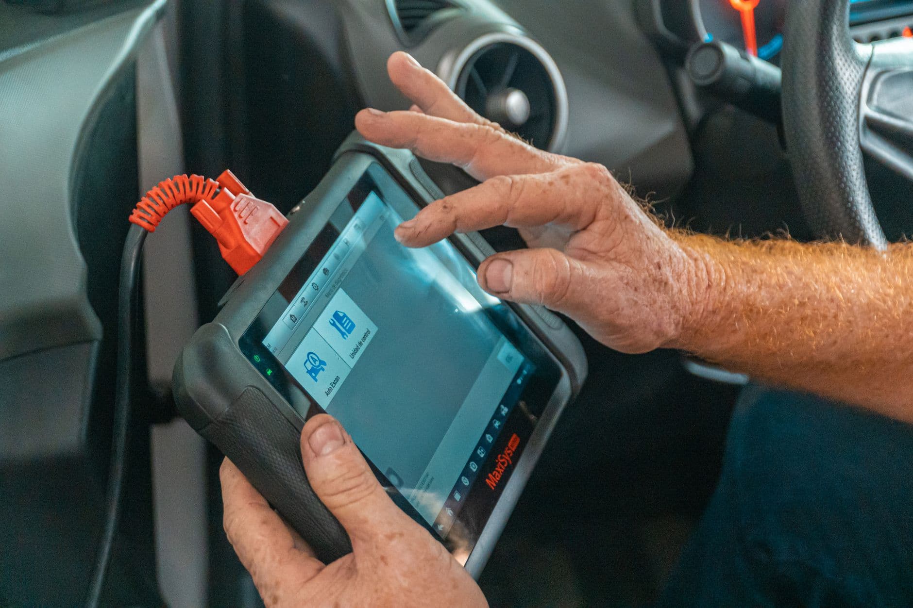 A technician reading live data from a scan tool