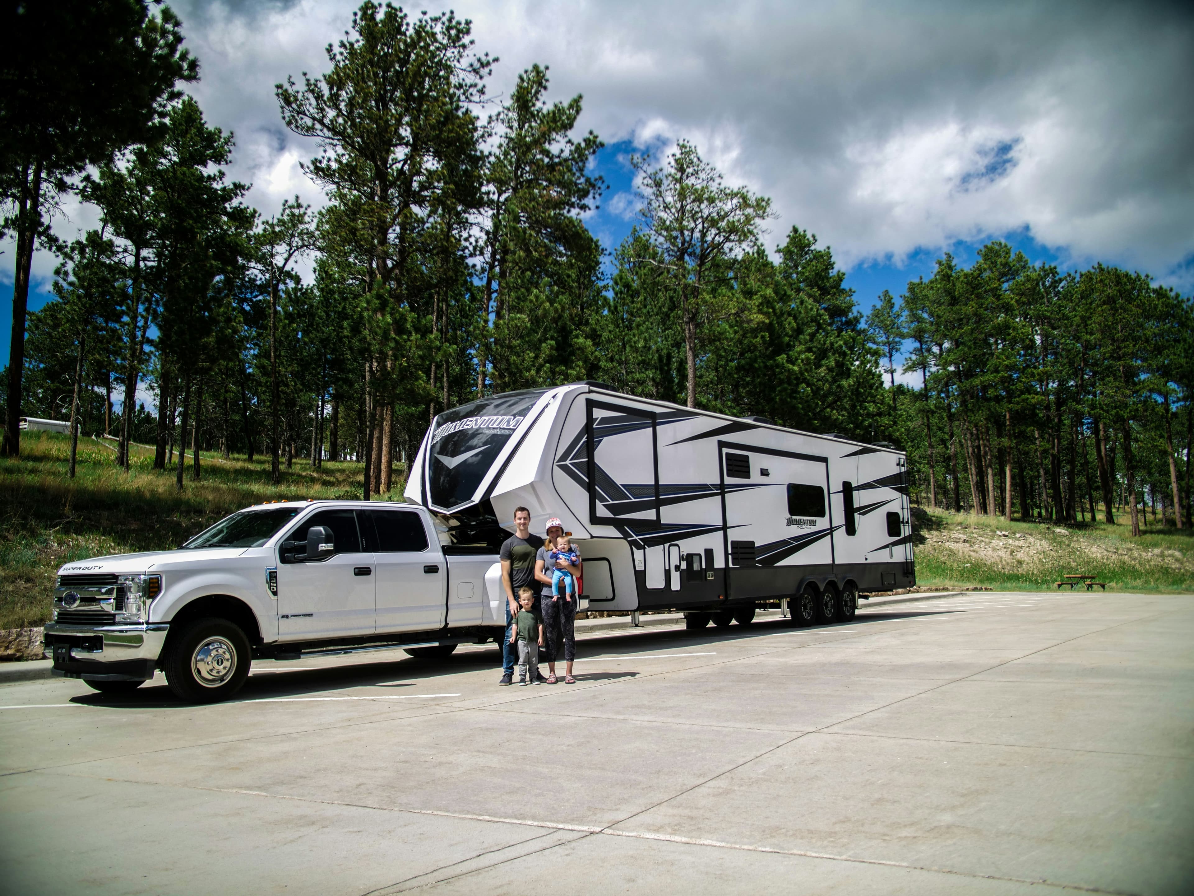 A Ford Super Duty dually towing a large fifth-wheel trailer